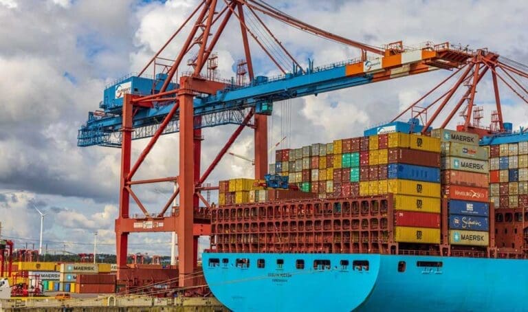Stacked shipping containers at the port. New and used shipping containers.