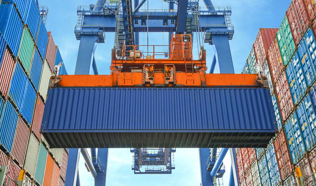 Shipping container delivery with crane