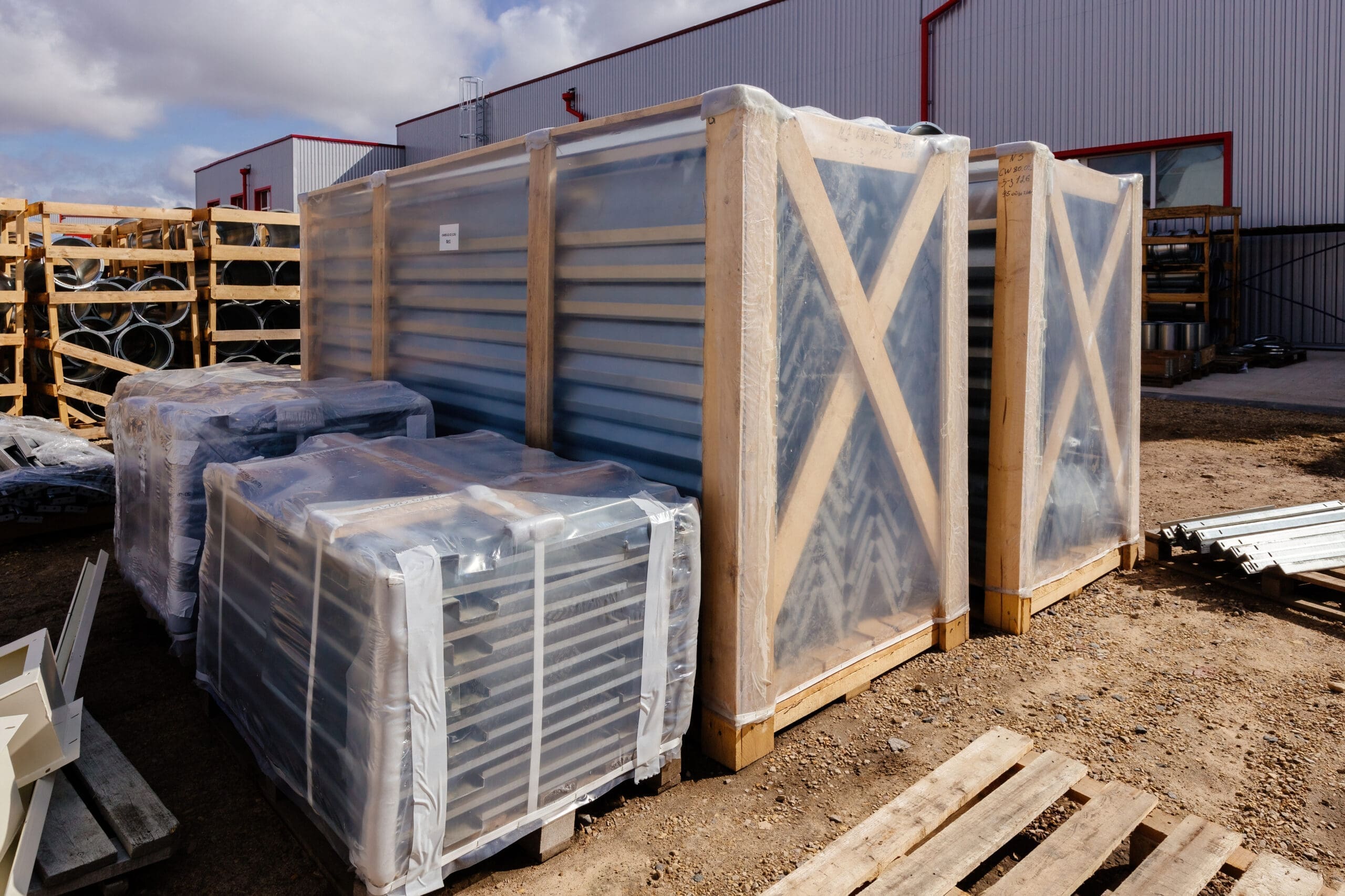 New manufactured steel spare parts packed in protective film in factory.