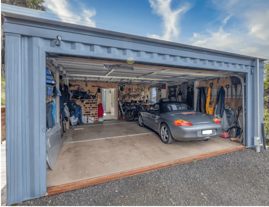 Shipping container garage painted with car storage. 