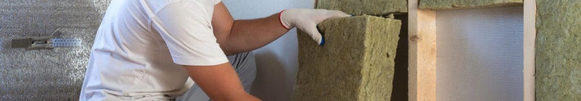 Man installing insulation